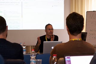Me teaching at the Italian ReactJSDay conference. Thanks to Jaga Santagostino for the photo.