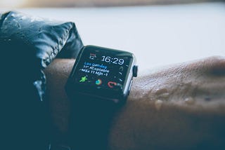 A hand with apple watch showing different health indicators