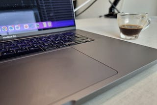 Illustration:  Computer’s keyboard with half cup of coffee.