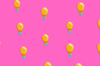 Lightbulbs on top of a bright pink background