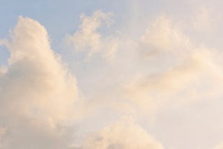 Aesthetic stock image of clouds in the sky creating a pink hue. The image is purely for decorative use only to support the blog post on core values.