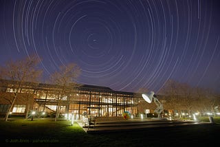 Star trails over the front of the Steve Jobs building at Pixar Animation Studios