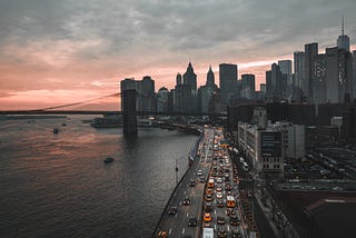 A cityscape with highway and skyscrapers.