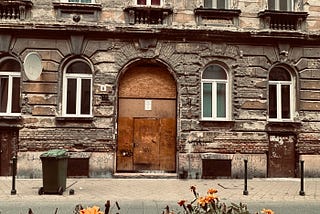A building facade in Budapest, showing grand design in a dilapidated state