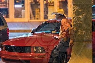 Local Denton, TX resident holding onto the local Confederate Monument in the downtown area.