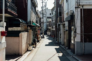 Back alley of Korea, showing residential & commercial buildings.