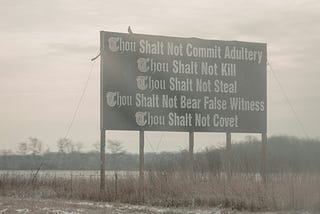 A billboard of the last five commandments from the Bible