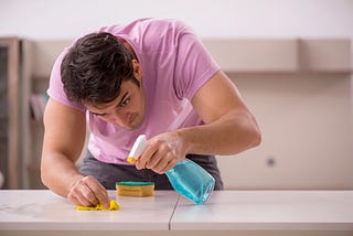 photo of a young man cleaning
