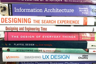 An image of a pile of UX books. Source: medium/@h_locke