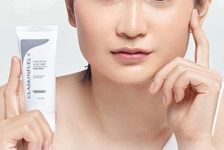 a white background with a woman and a tube of skincare