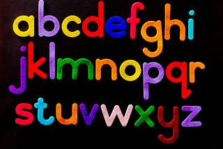 Colored felt cutouts of the alphabet (lower case)