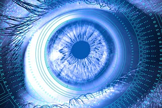 A closeup of a human eye in blue and white styled photography, with a digital contact lens display around it.