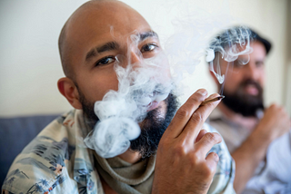 A man smoking a joint