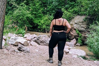 Girl standing in the woods