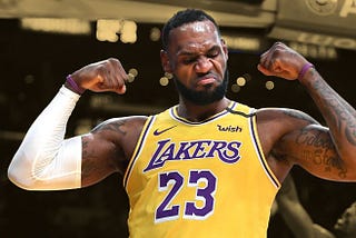 LeBron James flexing his arms in a Los Angeles Lakers jersey