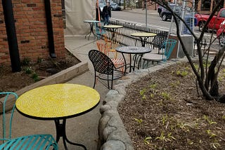 A picture of the outdoor patio at a hipster craft beer place in the big city. The running club would meet here after Tuesday night runs. I took this picture during a spring Marathon Race in March 2017. I just watched the race — photo by the author.
