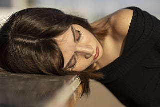 portrait of young brunette woman in an uncomfortable deep sleep