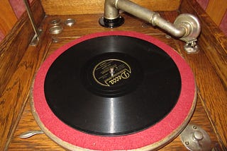 This shows an old-time record player.