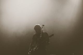 Guitarist on stage showing his personal branding aura