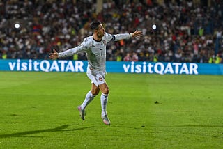 Cristiano Ronaldo running on the field with his arms open