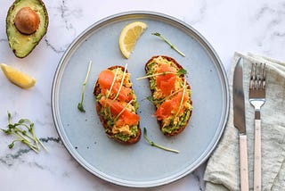 Avocado toast with eggs and salmon by FIT & NU™.