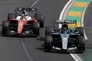 George Russell of Mercedes passing Charles Leclerc of Ferrari