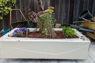 Repurposing a shower tub into a flower container