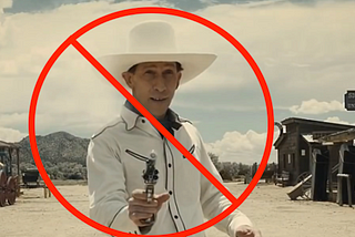 Buster Scruggs in a white shirt with a white hat, pointing a gun at the camera, with a nuke sign added.