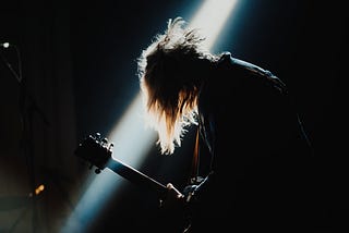 A guitarist playing on stage