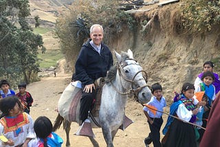 The future Pope Leo XIV rides a white horse among indigenous children in Peru, where he served for 20 years, first as an Augustinian missionary, then as archbishop.