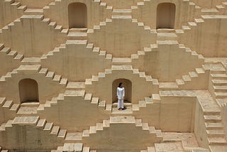 A woman in a labyrinth of stairs