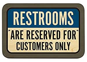 Picture of a sign saying Restrooms are reserved for customers only