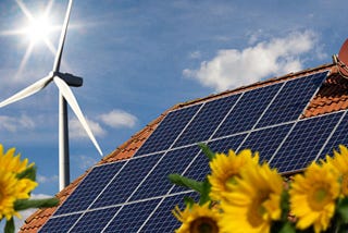 Solar array and wind turbine in the sunflower field in Oklahoma