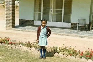 Girl dressed in school uniform for first day of school