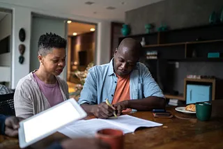 Two people sitting at a table.