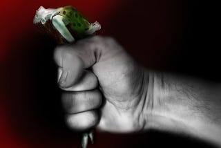 A woman, small as a doll, tightly squeezed in a firm fist