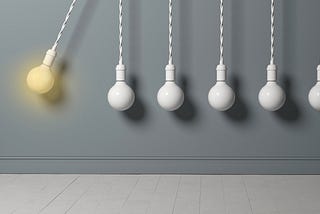 Light bulb as a pendulum, hitting other lightbulbs like in a newton cradle.