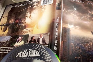 Photo of the front & back cover of The Great Buddha Arrival DVD case and partial shot of DVD disc.