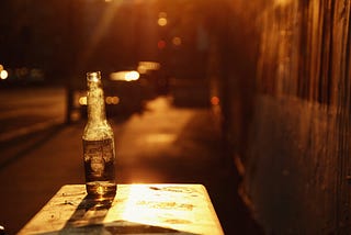 A sepia-toned picture of an alcohol bottle.