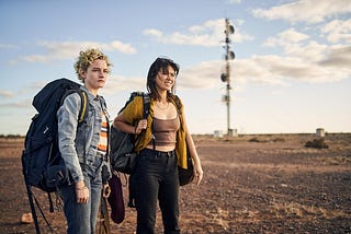 Julia Garner and Jessica Henwick in The Royal Hotel | Credit: Neon