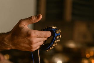 A Person Holding a Ghungroo