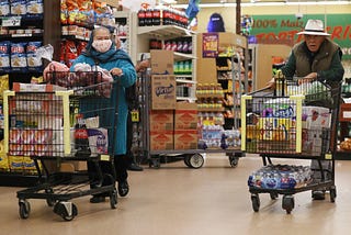 Seniors shop for groceries at Northgate Gonzalez Market in Los Angeles during special hours open to seniors and the disabled.