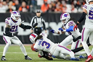 Damar Hamlin of the Buffalo Bills tackling Tee Higgins of the Cincinnati Bengals on Monday Night Football on January 1, 2023