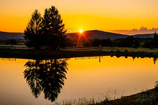 Almost Heaven — the sun sets over a distant mountain in West Virginia