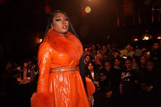 Megan Thee Stallion onstage in front of a crowd.