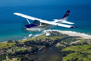 Photo of a Cessna in flight.