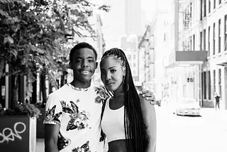 Black and white photo of the author and her son posing on a street.
