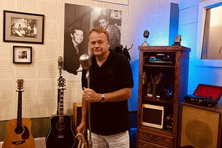 Joseph Serwach with the world’s most famous microphone at the iconic Sun Studios in Memphis, Tennessee, where music legends including Elvis Presley, Johnny Cash, Carl Perkins, and Jerry Lee Lewis began their careers, and a beautiful new thing called rock and roll. Image by Debra Serwach.