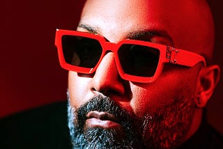 Man wearing bold red sunglasses