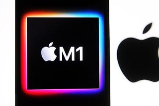 The Apple M1 chip computer logo seen on a mobile phone screen next to a larger Apple logo